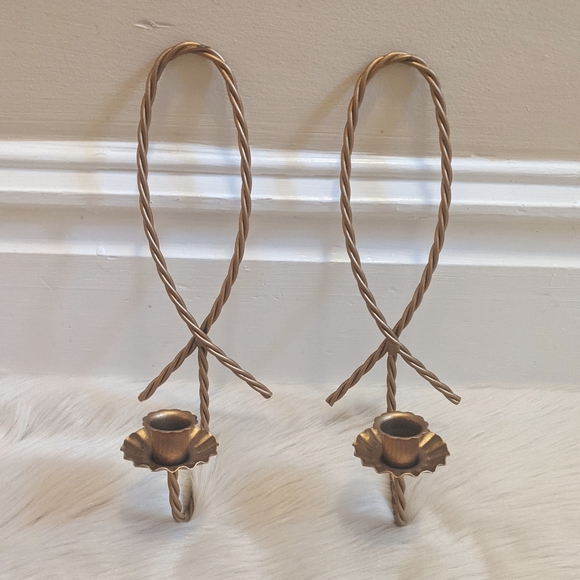 Vintage gold metal candle wall sconces.